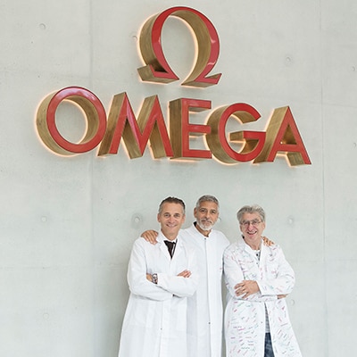 George Clooney, Raynald Aeschlimann and Nick Hayek at the Omega factory